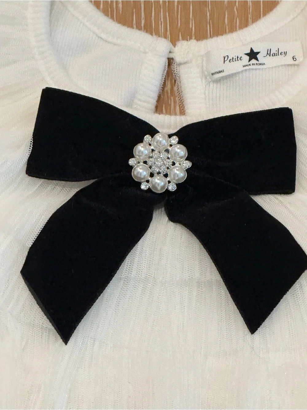New, never worn. Size 6 Tulle Party Dress with Black Bow